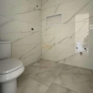 Casa com 272m², 3 dormitórios, 3 suítes, 4 vagas no bairro Itapeva em Torres para Comprar