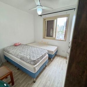 Apartamento com 65m², 2 dormitórios, 1 vaga no Edifício Porto Seguro em Torres para Comprar