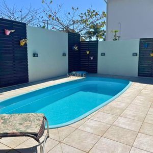 Casa com 240m², 4 dormitórios, 2 suítes, 2 vagas no bairro Praia Paraíso em Torres para Comprar