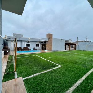 Casa com 670m², 5 dormitórios, 3 suítes, 3 vagas no bairro Bellatorres em Passo de Torres para Comprar