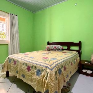Casa com 101m², 2 dormitórios no bairro Igra Sul em Torres para Comprar