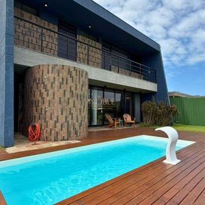 Casa de Condomínio com 417m², 4 dormitórios, 4 suítes, 2 vagas no Reserva das Águas em Torres para Comprar