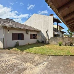 Casa com 145m², 3 dormitórios, 1 suíte, 2 vagas no bairro Igra Sul em Torres para Comprar