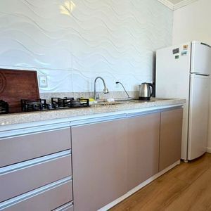 Casa com 120m², 3 dormitórios, 1 suíte, 2 vagas no bairro Loteamento Caravelle em Passo de Torres para Comprar