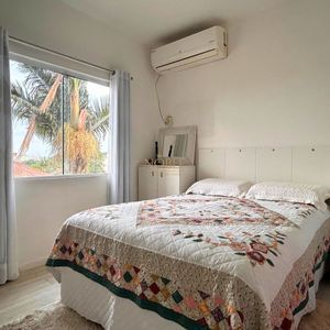 Casa com 170m², 2 dormitórios, 3 vagas no bairro Centenário em Torres para Comprar