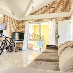 Casa, 2 dormitórios, 2 vagas no bairro Igra Norte em Torres para Comprar