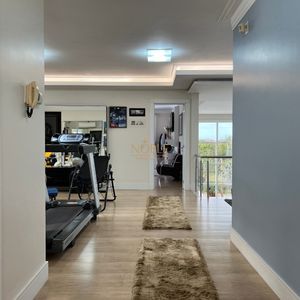 Casa com 600m², 4 dormitórios, 1 suíte, 4 vagas no bairro Igra Norte em Torres para Comprar