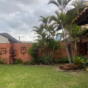 Casa com 247m², 5 dormitórios, 3 suítes, 3 vagas no bairro Praia Grande em Torres para Comprar