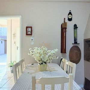 Casa com 171m², 4 dormitórios, 3 vagas no bairro Porto Alegre em Torres para Comprar