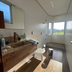 Casa de Condomínio com 260m², 3 dormitórios, 3 suítes, 4 vagas no Reserva das Águas em Torres para Comprar