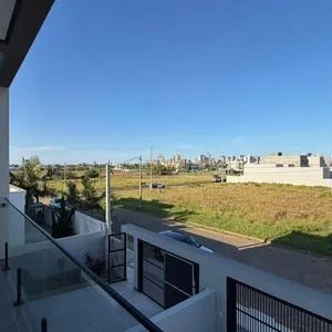 Geminado com 141m², 3 dormitórios, 1 suíte, 2 vagas no bairro Morada das Palmeiras em Torres para Comprar