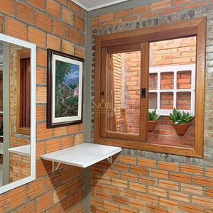 Casa com 98m², 3 dormitórios, 2 vagas no bairro Praia da Cal em Torres para Comprar