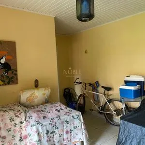 Casa com 247m², 5 dormitórios, 3 suítes, 3 vagas no bairro Praia Grande em Torres para Comprar