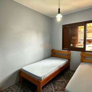 Apartamento com 94m², 3 dormitórios, 1 suíte, 2 vagas no Edifício Saron em Torres para Comprar
