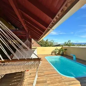 Casa com 108m², 2 dormitórios, 2 vagas no bairro Capão do Cravo em Passo de Torres para Comprar