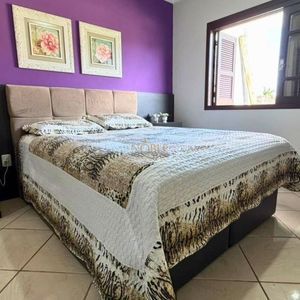 Casa com 145m², 3 dormitórios, 1 suíte, 2 vagas no bairro Igra Sul em Torres para Comprar