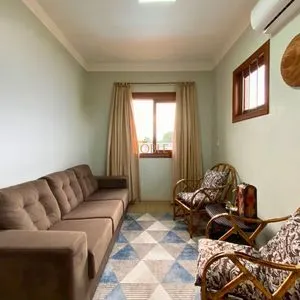 Casa com 272m², 4 dormitórios, 1 suíte, 3 vagas no bairro Igra Norte em Torres para Comprar