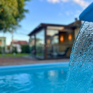 Casa com 184m², 3 dormitórios, 1 suíte, 2 vagas no bairro Igra Norte em Torres para Comprar