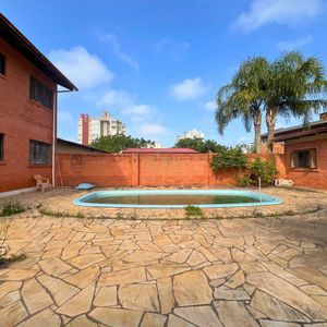 Casa, 6 dormitórios, 1 suíte, 4 vagas no bairro Stan em Torres para Comprar