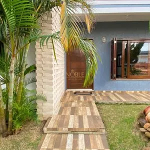 Casa com 148m², 3 dormitórios, 1 suíte, 2 vagas no bairro Morada das Palmeiras em Torres para Comprar
