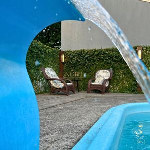 Casa com 184m², 3 dormitórios, 1 suíte, 2 vagas no bairro Igra Norte em Torres para Comprar