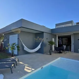 Casa de Condomínio com 206m², 4 dormitórios, 4 suítes, 2 vagas no Reserva das Águas em Torres para Comprar
