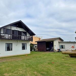 Casa com 300m², 4 dormitórios, 1 suíte no bairro Getúlio Vargas em Torres para Comprar
