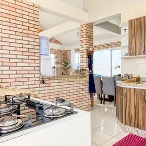 Casa, 2 dormitórios, 2 vagas no bairro Igra Norte em Torres para Comprar