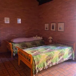 Casa com 247m², 5 dormitórios, 3 suítes, 3 vagas no bairro Praia Grande em Torres para Comprar