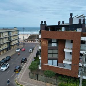 Apartamento com 71m², 2 dormitórios, 1 suíte, 2 vagas no Residencial DI Capri em Torres para Comprar
