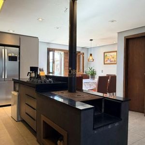 Casa com 228m², 3 dormitórios, 1 suíte, 2 vagas no bairro Stan em Torres para Comprar