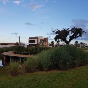 Casa de Condomínio com 416m², 3 dormitórios, 1 suíte, 2 vagas no Reserva das Águas em Torres para Comprar