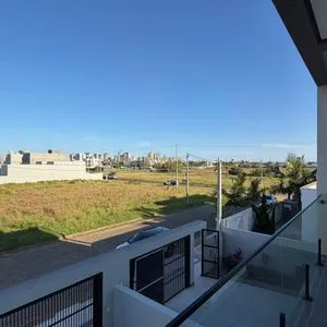 Geminado com 141m², 3 dormitórios, 1 suíte, 2 vagas no bairro Morada das Palmeiras em Torres para Comprar