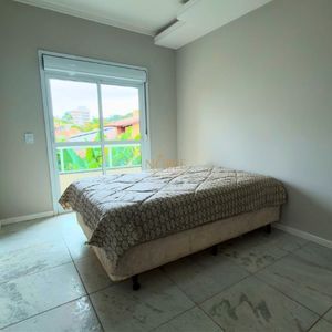 Sobrado com 127m², 3 dormitórios, 1 suíte, 1 vaga no Ilhas Travertino em Torres para Comprar