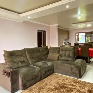 Casa com 148m², 3 dormitórios, 1 suíte, 2 vagas no bairro Morada das Palmeiras em Torres para Comprar
