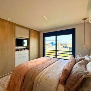 Sobrado com 93m², 2 dormitórios, 2 suítes, 1 vaga no bairro Morada das Palmeiras em Torres para Comprar