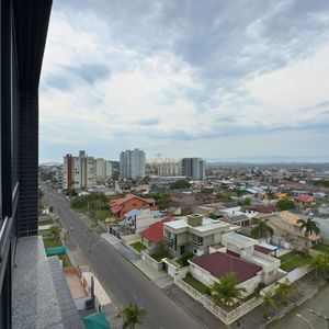 Apartamento com 72m², 2 dormitórios, 1 suíte, 1 vaga no Topazio em Torres para Comprar