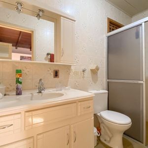 Casa com 152m², 3 dormitórios, 1 suíte, 4 vagas no bairro Praia da Cal em Torres para Comprar