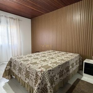 Casa com 136m², 3 dormitórios, 1 suíte, 2 vagas no bairro Praia da Cal em Torres para Comprar
