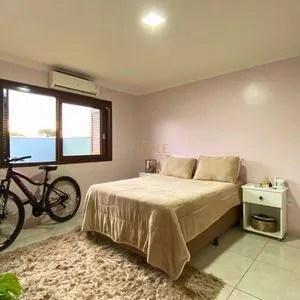 Casa com 148m², 3 dormitórios, 1 suíte, 2 vagas no bairro Morada das Palmeiras em Torres para Comprar
