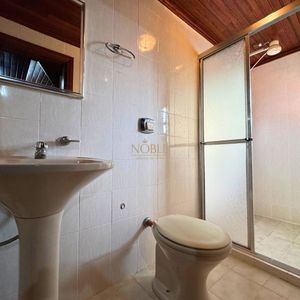 Casa com 220m², 4 dormitórios, 4 suítes, 2 vagas no bairro Igra Norte em Torres para Comprar