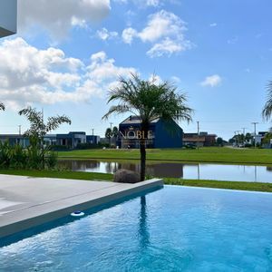 Casa de Condomínio com 264m², 4 dormitórios, 4 suítes, 2 vagas no Reserva das Águas em Torres para Comprar