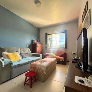 Casa, 3 dormitórios, 1 suíte, 2 vagas no bairro Igra Sul em Torres para Comprar