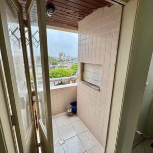 Apartamento com 65m², 2 dormitórios, 1 vaga no Edifício Porto Seguro em Torres para Comprar