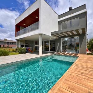 Casa de Condomínio com 348m², 4 dormitórios, 3 suítes, 2 vagas no Condomínio Ilhas Park em Torres para Comprar