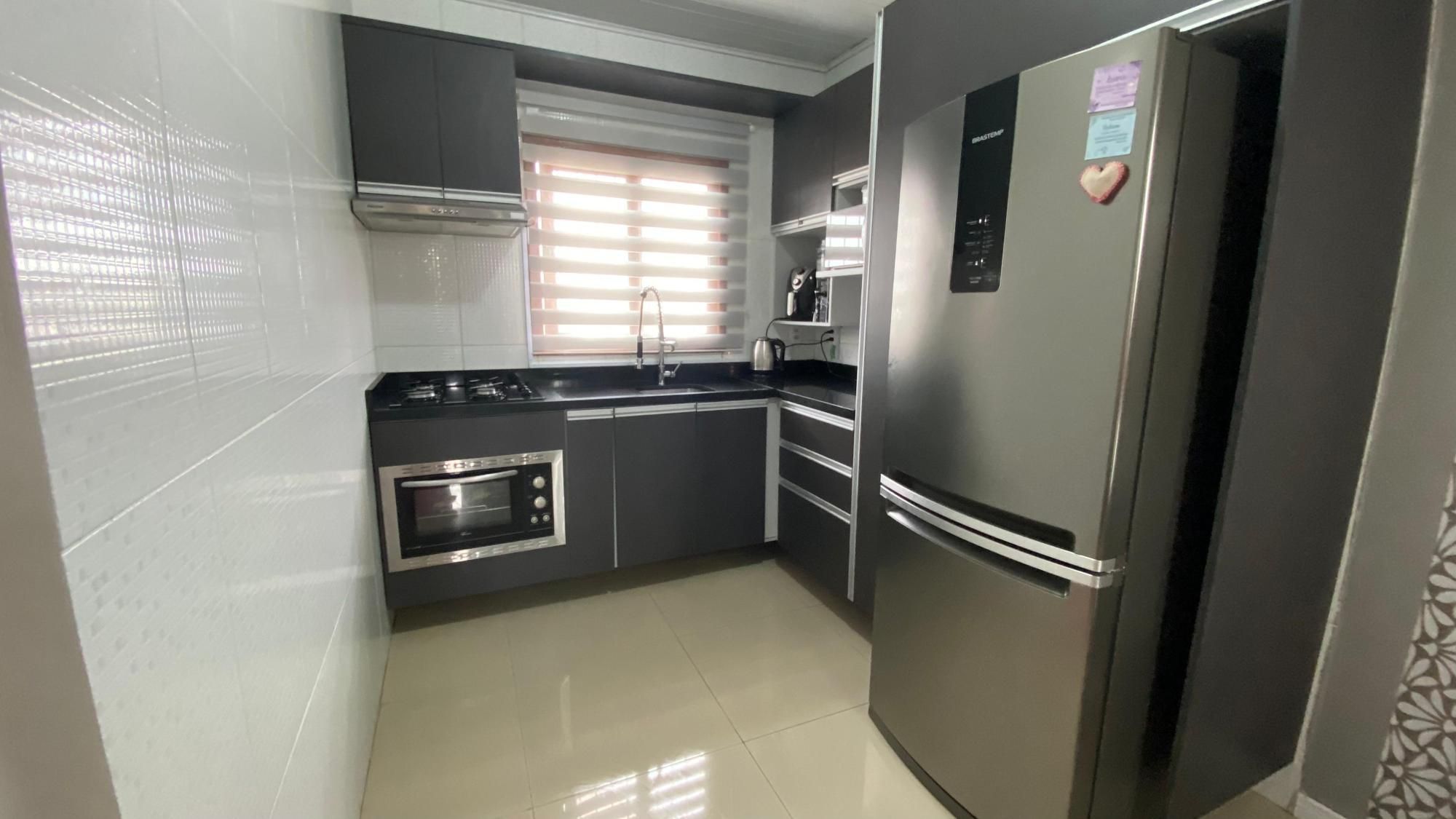 Casa com 113m², localizada no bairro Mario Quintana em Porto Alegre/RS.
