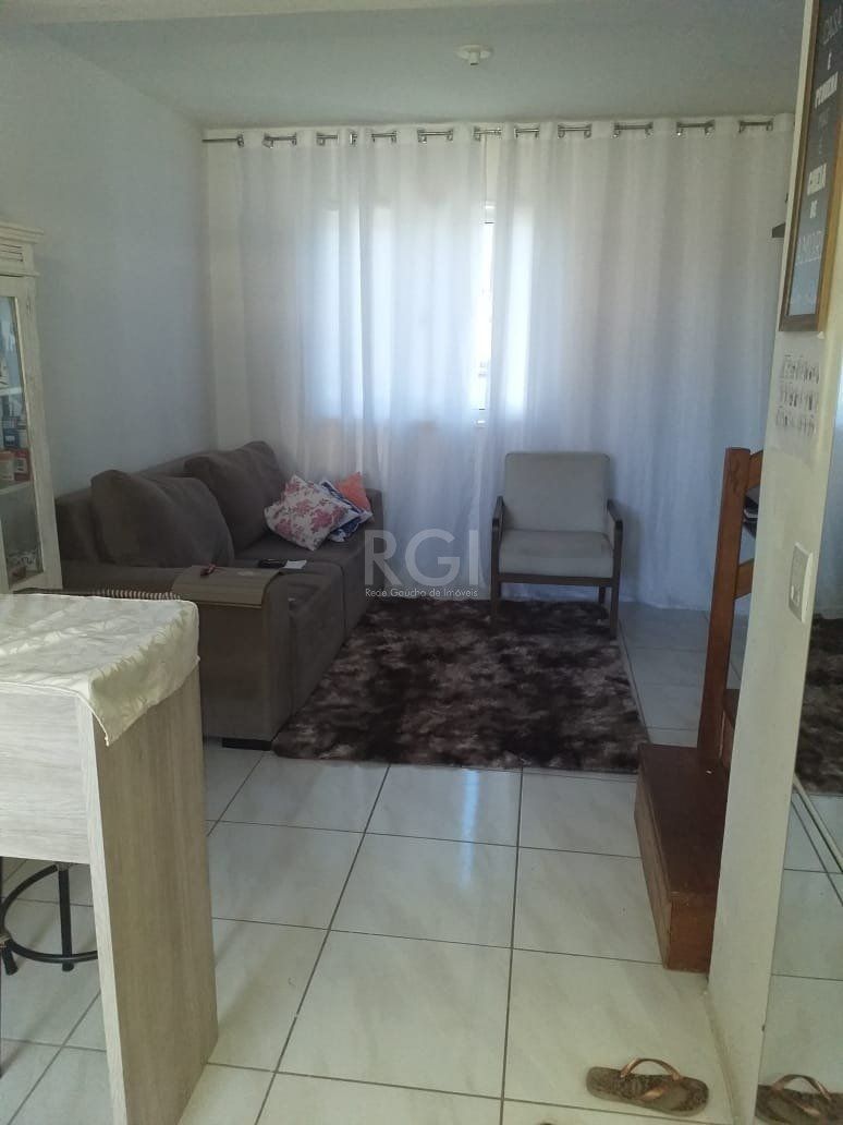 Casa com 2 quartos, banheiro, área de serviço, cozinha, vaga de garagem, no bairro Aberta dos Morros/RS