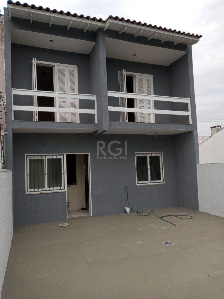 Casa à venda com 170m², 5 quartos, 2 vagas no bairro Hípica em Porto Alegre