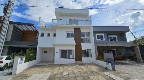 Casa de Condomínio à venda com 3 quartos, 173m², 1 suíte, 2 vagas, Rua Ivo Walter Kern no bairro Aberta dos Morros em Porto Alegre
