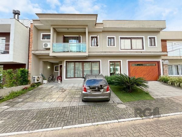 Casa de Condomínio à venda com 137m², 3 quartos, 1 suíte, 3 vagas no bairro Hípica em Porto Alegre